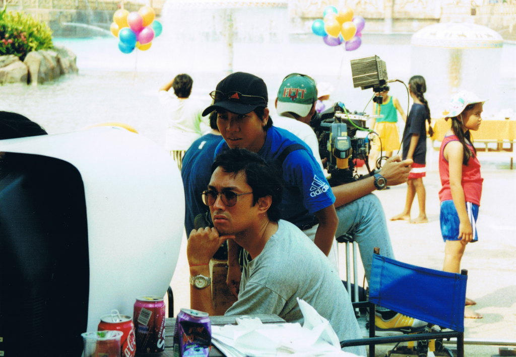 Lester Alfonso, director at work in Malaysia while producer looks over his shoulder, 2001